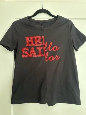 Stylish Black Graphic Tee with Red Script Size XS